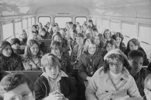 Black and white children on a school bus, riding from the suburbs to an inner city school in Charlotte, North Caroline, 1973