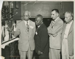 W. R. Brown and I. B. Johnson of the Aesculapian Medical Society showing X-rays, ca. 1950s