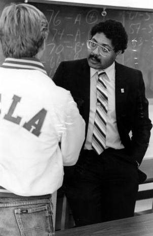 William G. Mays speaking with a student.