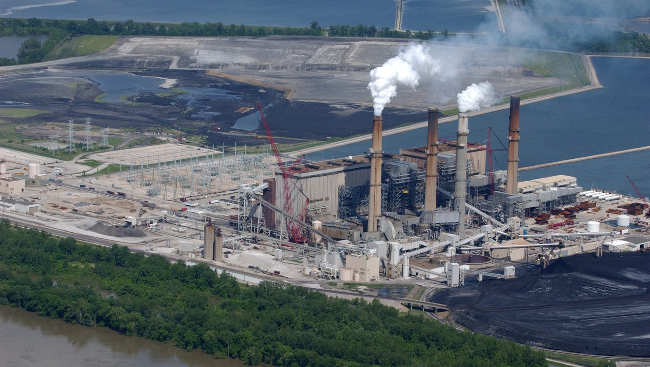 Aerial view of a power plant situated on the banks of river.