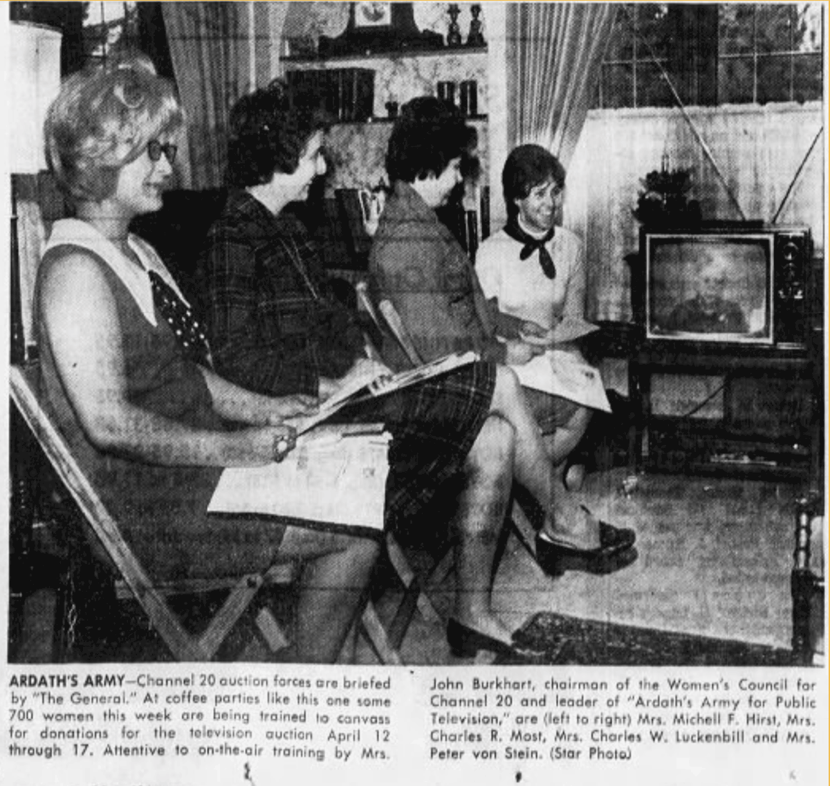 A newspaper clipping has a photo of four women seated in folding chairs, and lined up to the left of a television. The women are watching on-air training being presented by A. Burkhart.