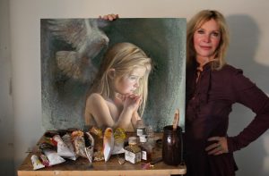 Nancy with her painting “Be Still,” the official image chosen to represent the Sandy Hook Foundation, ca. 2013