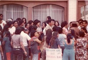 Benito Lopez, Carmen Velasquez, and staff from AMOS (Associated Migrant Opportunity Services, Inc.) and supporters of migrant farm workers rights organize a march from Marion, Indiana to the Governor's Mansion in Indianapolis, 1971