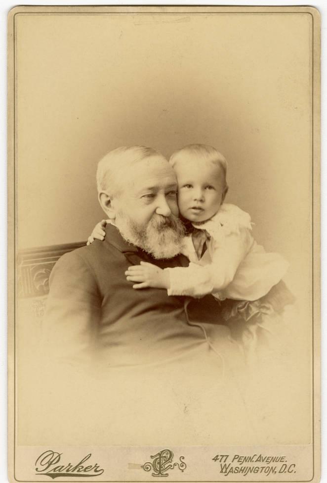 A young boy hugs Benjamin Harrison.