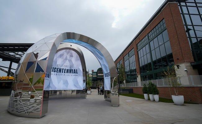A large arched structure with a mirrored exterior and video screen interior.