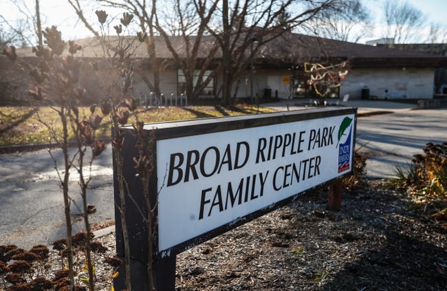 A low, rectangular sign reading "Broad Ripple Park Family Center" is shown. There is a long, low building in the background.