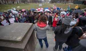 Shelly Fitzgerald, a Roncalli High School counsellor who had been placed on administrative leave, speaks during the Women's March, 2019