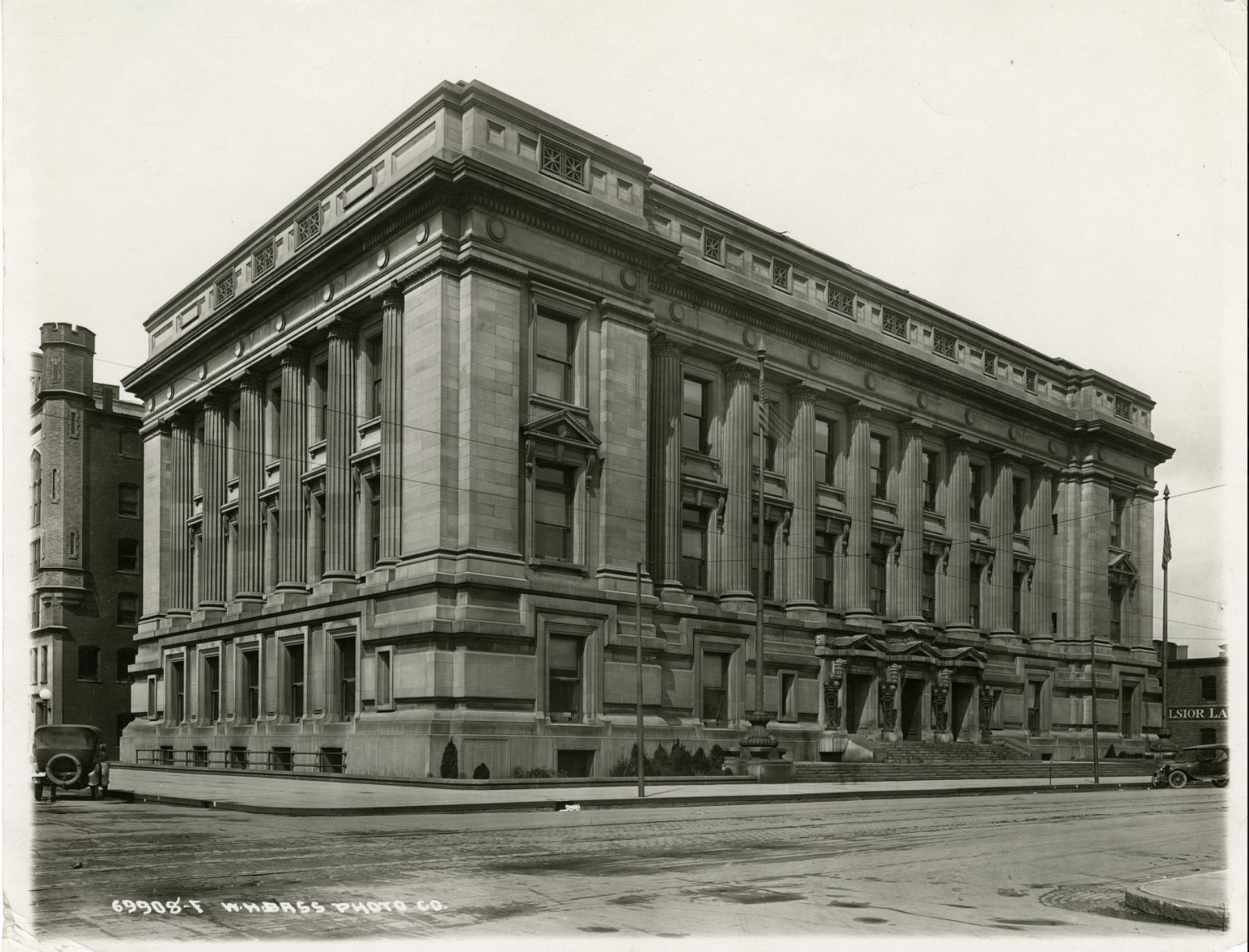 An exterior angled view of the three-story stone building that served as the Indianapolis City Hall.