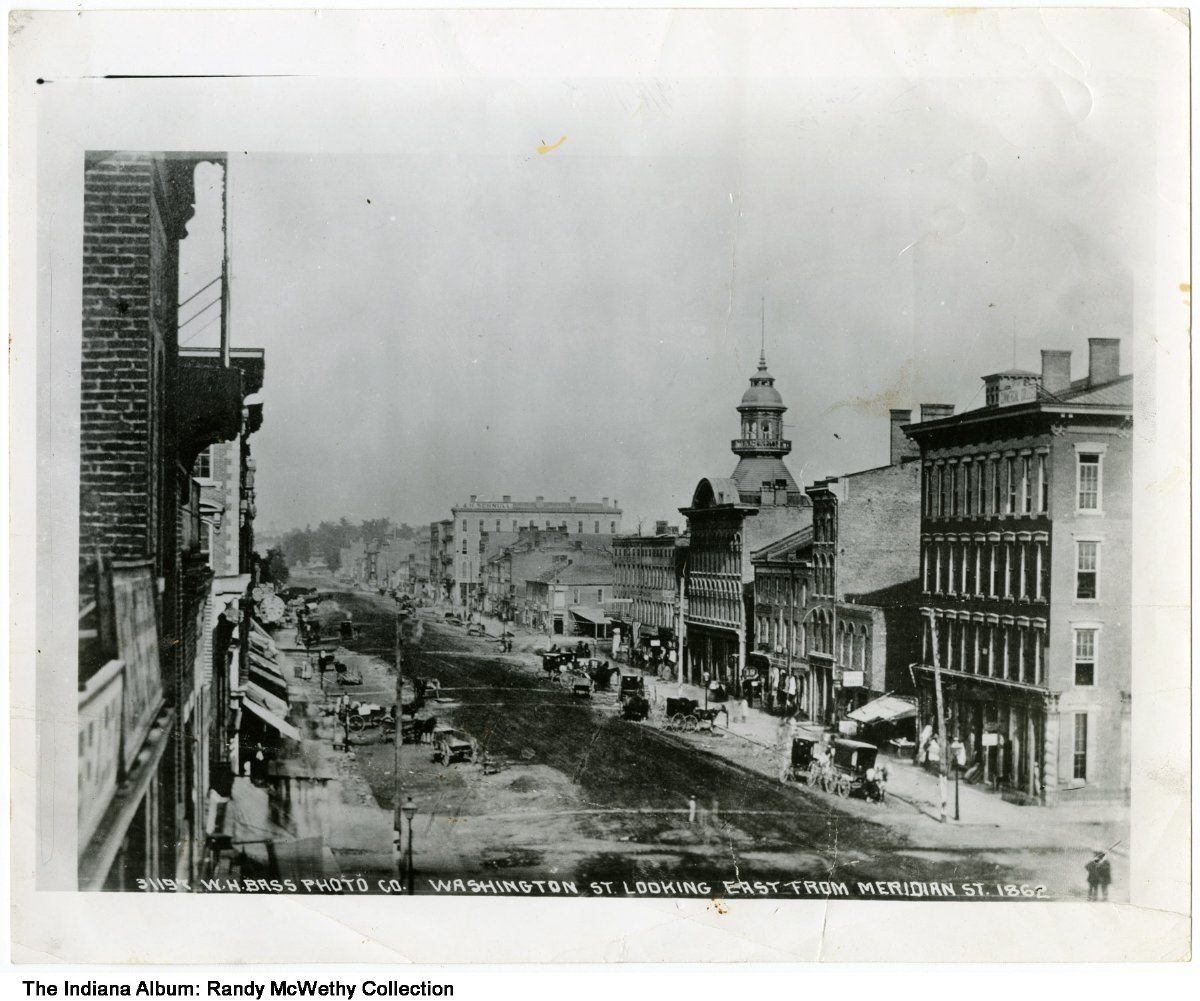 Photograph of a wide street lined with buildings.