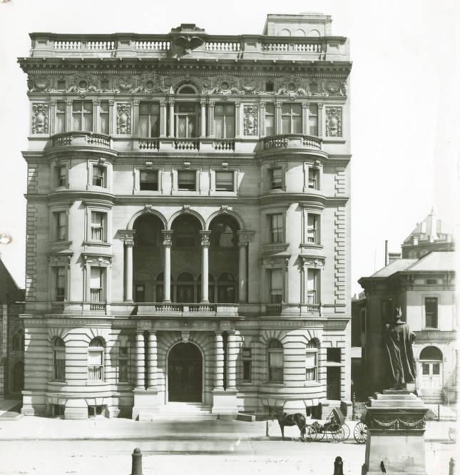 The entrance of an ornate multistory building.