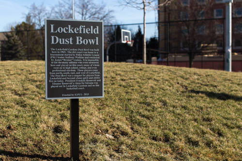A sign on a post says "Lockefield Dust Bowl" and gives a description of the event.