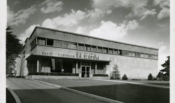 A two-story stone office building. Above the entrance are the words "Radio Television WFBM"