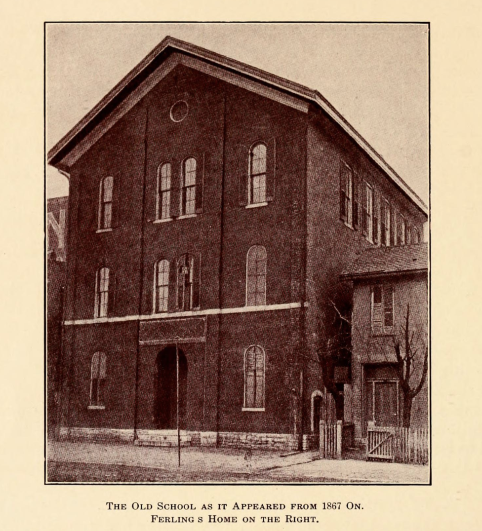 The three-story brick, gable front building has narrow arched windows and an arched entrance. Under the drawing is "The Old School as it Appeared from 1867 On. Ferling s Home on the Right."
