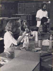 Volunteers clean damaged books following the fire at Warren Branch, 1979