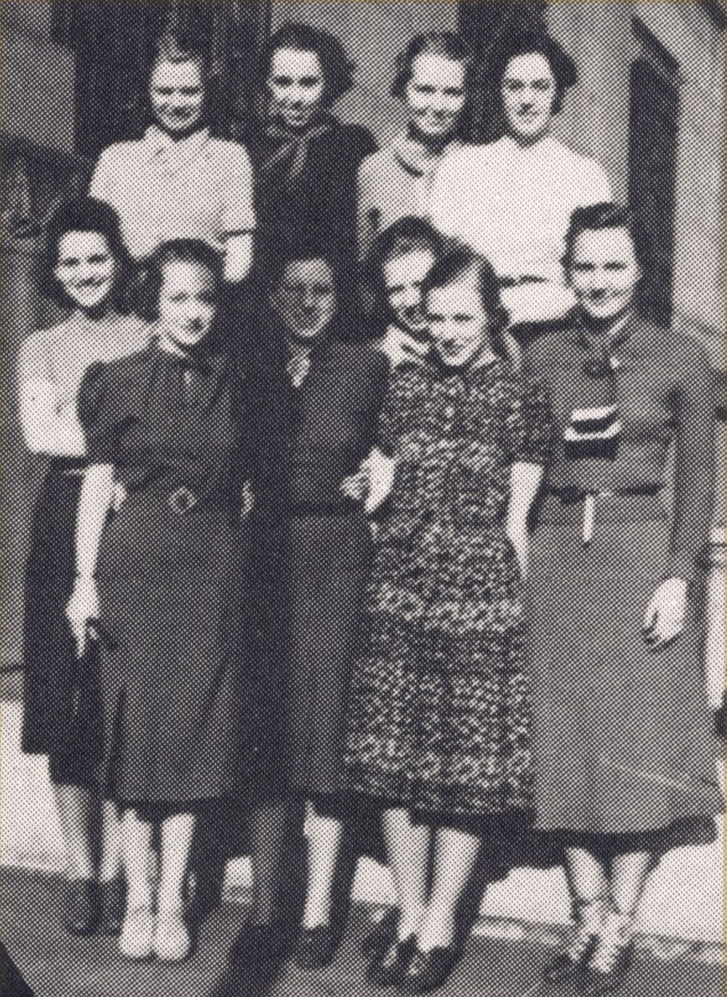 A group of women stand together.