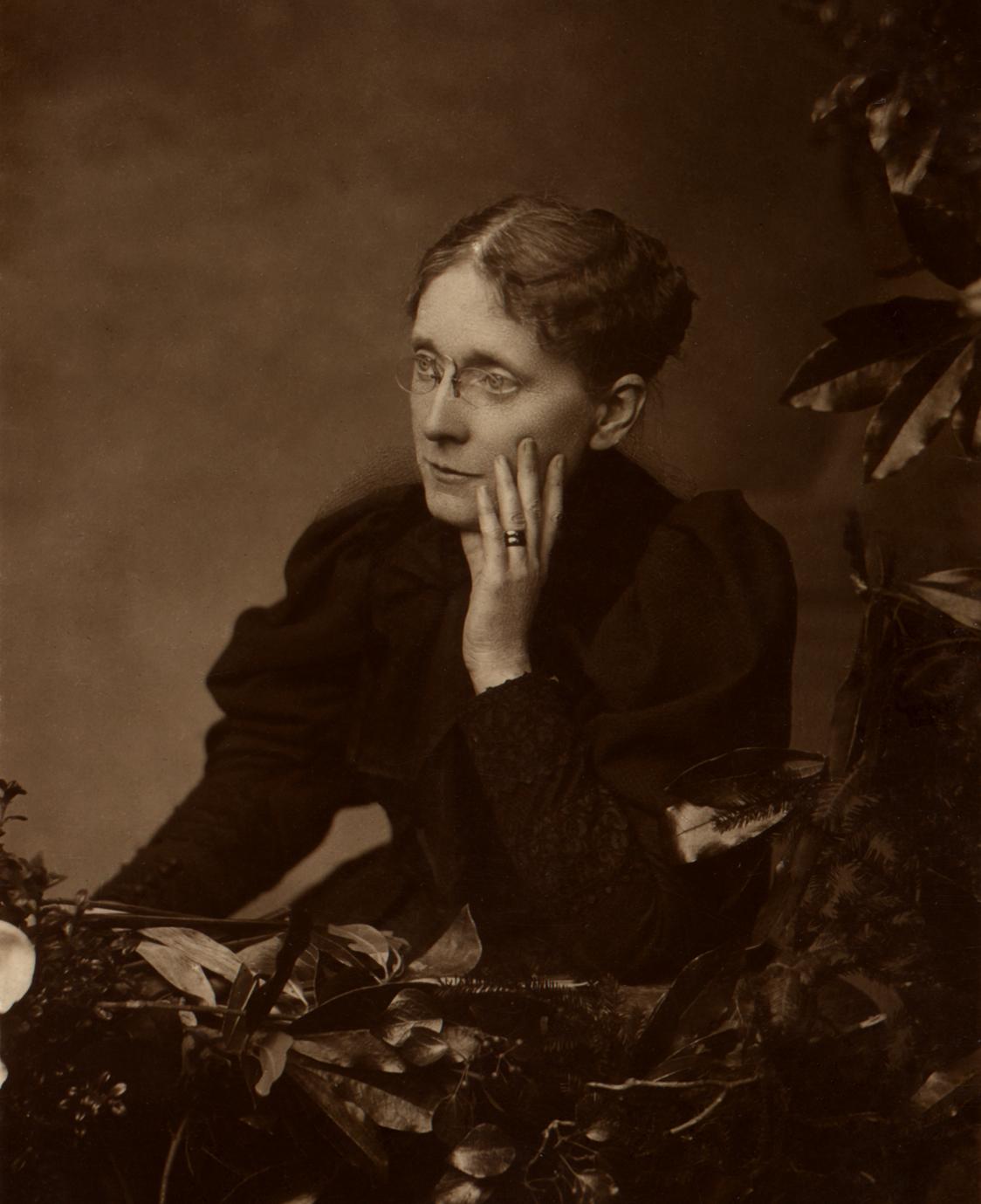 Frances Willard sits with her cheek gently resting on her hand.