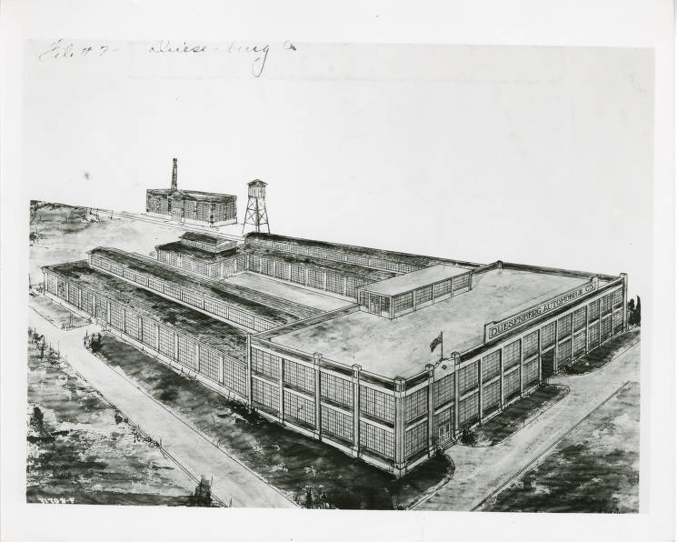 The drawing shows an overhead view of a large, rectangular, two-story industrial building. Two wings extend off the back of the main plant.