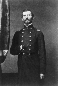 George McGinnis stands in his military uniform.