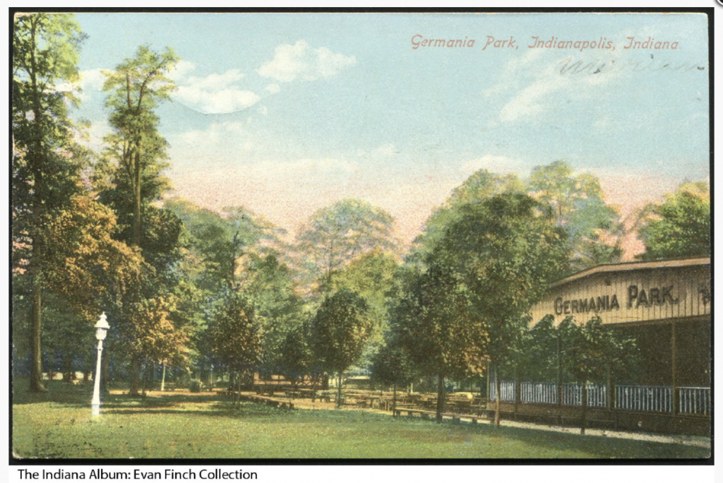 A postcard shows a painting of a wooded park. There is a shelter building with "Germania Park" on the front.