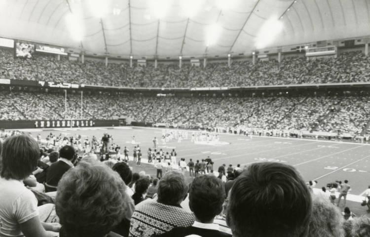People fill the seats of a stadium.