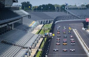 With empty stands, IndyCar Series driver Marco Andretti leads the field three wide prior to the green flag of the 104th running of the Indianapolis 500, 2021