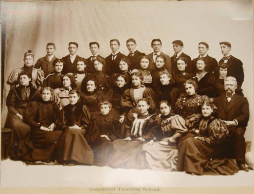 A group of young adults gather for a class photo.