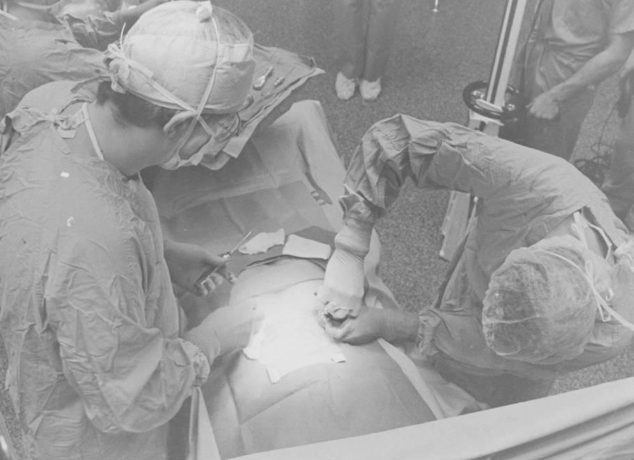 Two surgeons are operating on a patient.