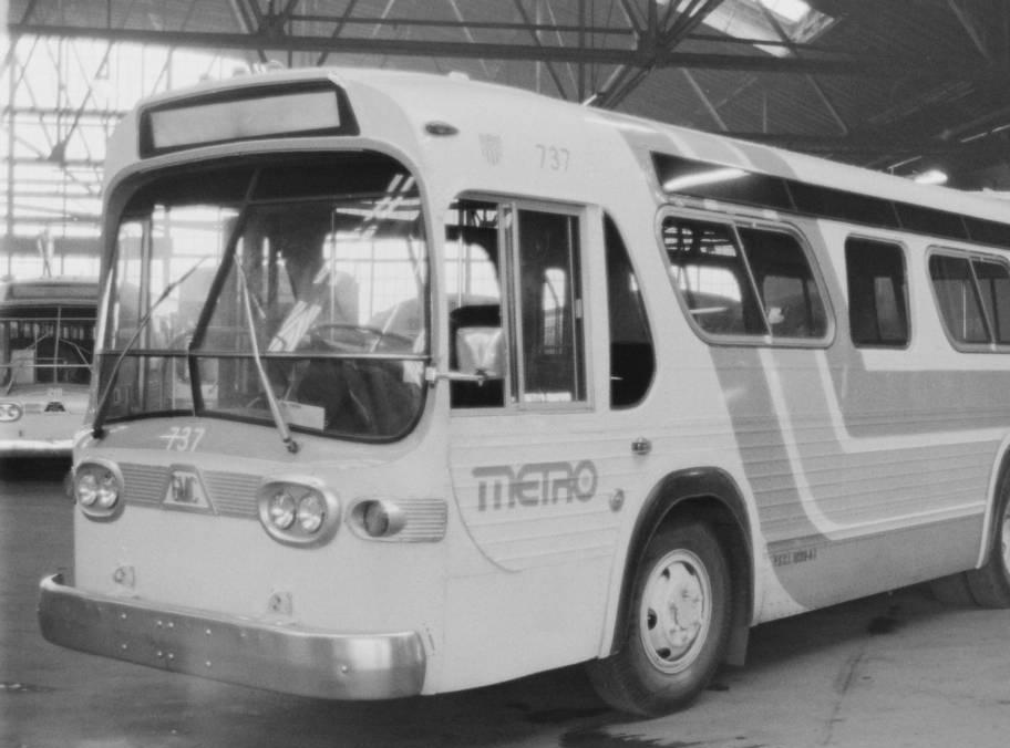 A Metro Bus is parked in a terminal.