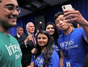 People gather for photos with Vice President Mike Pence after the Infosys announcement event on April 26, 2018.  