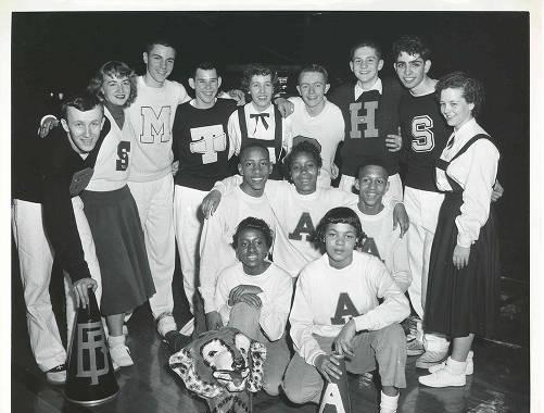 Several Black and White students stand together for a group photo.