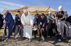 People gather at a ground breaking ceremony for the Islamic Life Center, 2022