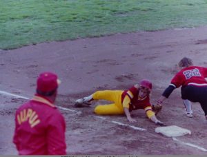 Metro softball player in action (coach Nick Kellum at left), 1989