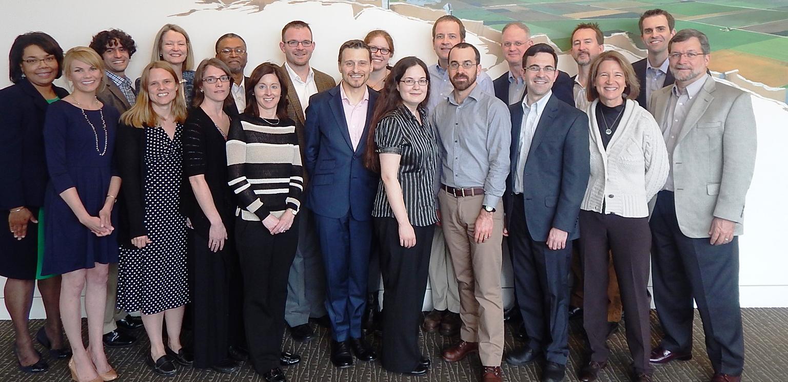 A group of people stand together.