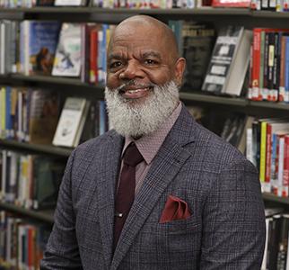 Headshot of Gregory Hill.