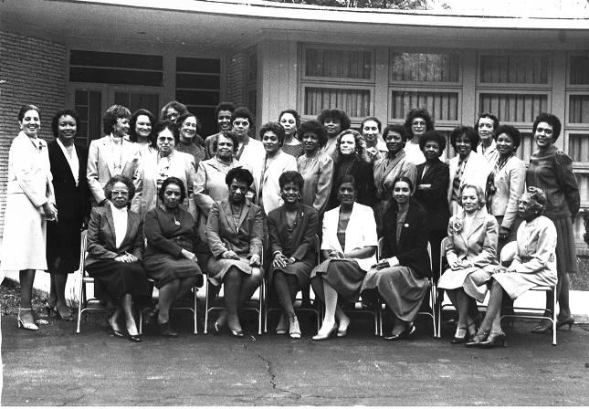 A group of people pose together for a portrait.