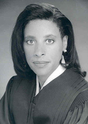 Headshot of a woman wearing judge's robes.