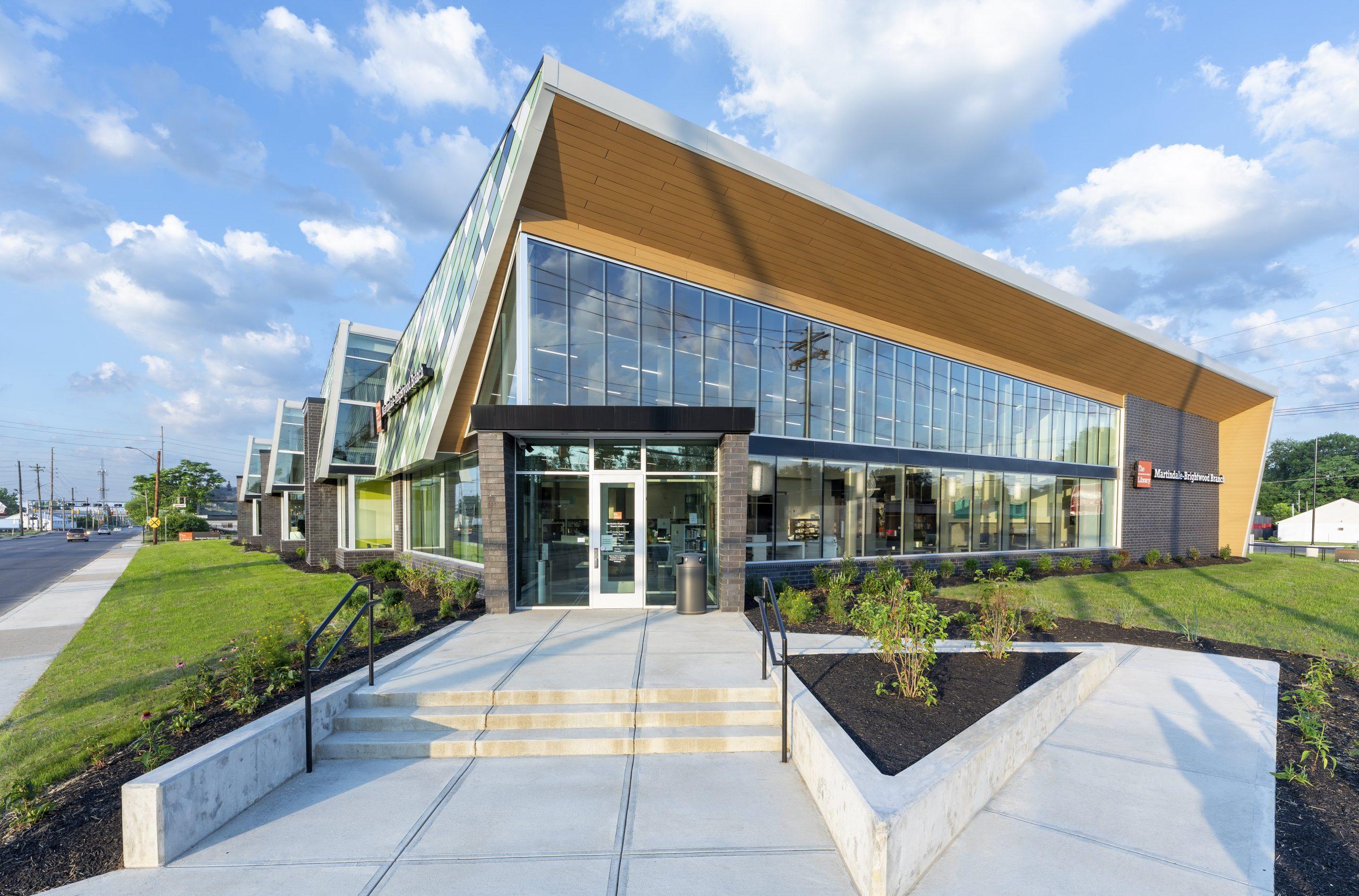 Exterior view of the entrance to a glass fronted building.