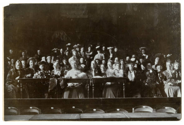 A large group of women sit together.