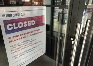 A sign announcing the shuttering of Helium Comedy Club amid fears over coronavirus and COVID-19, 2020
