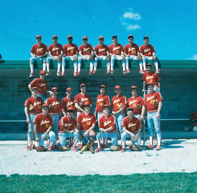 A group of baseball players pose together.