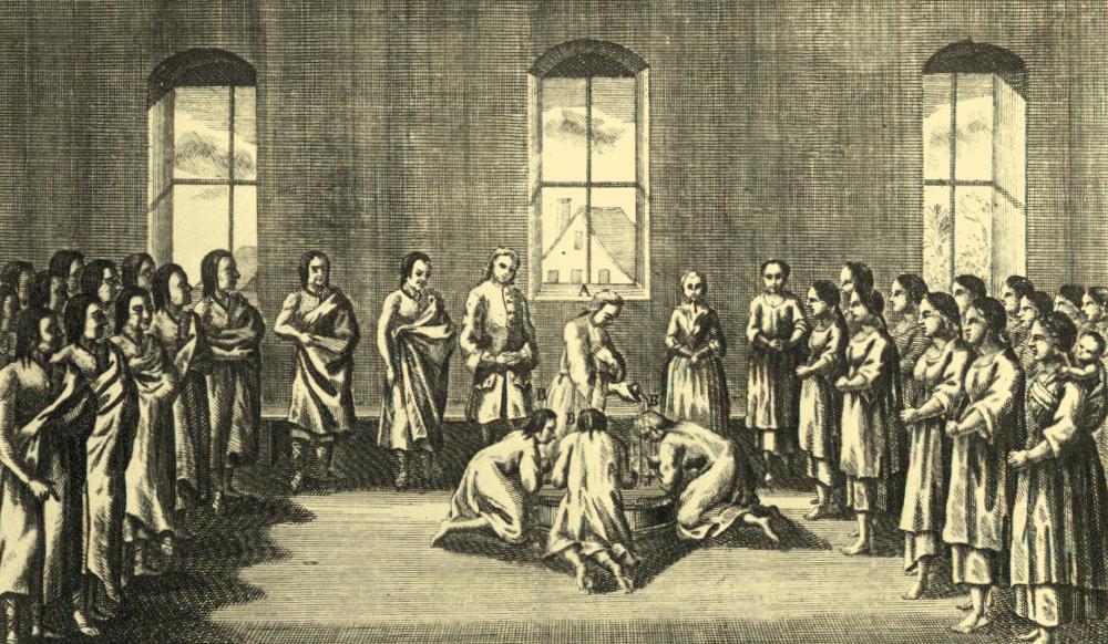 Illustration of a group of people in a room. Three people are in the middle being baptized. People watch from the sides of the room.