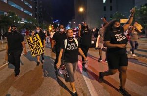 Protesters walk the streets during protests downtown, May 2020