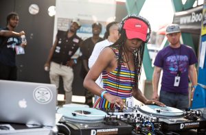 A woman DJs at the Chreece hip-hop festival, 2017