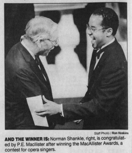 Norman Shankle, right, is congratulated by P. E. MacAllister after winning the 1998 MacAllister Awards.