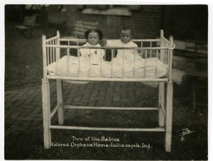 Infants in a crib outside the Indianapolis Asylum for Friendless Colored Children, ca. 1923