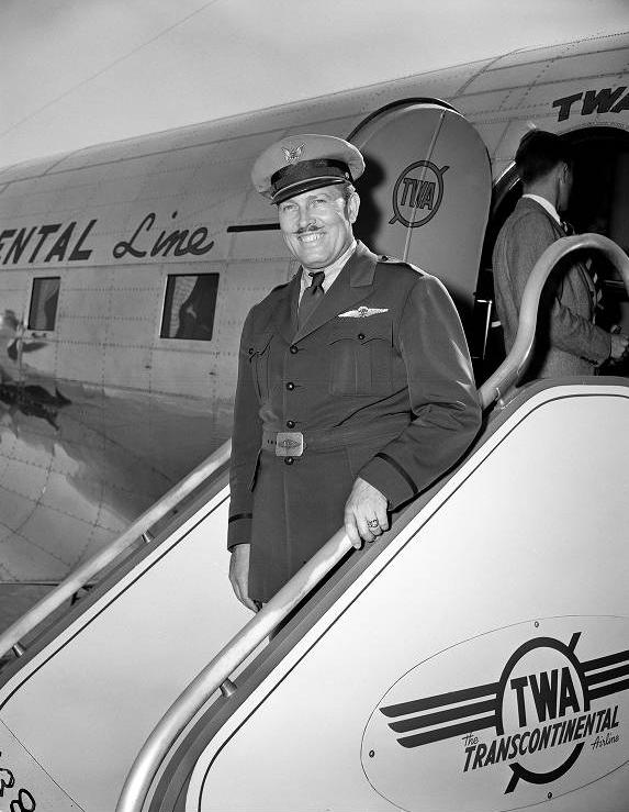 Roscoe Turner exiting a Trans World Airplane (TWA) at the Indianapolis Municipal Airport.