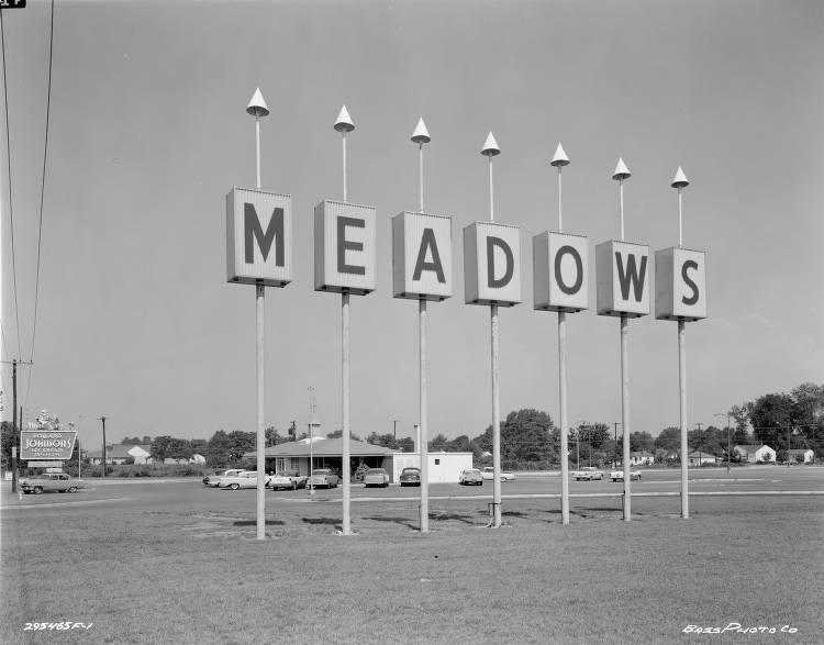 A sign that says "Meadows."