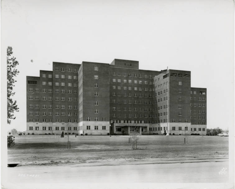 A nine-story brick hospital building.