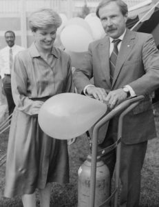 Dr. Gerald L. Bepko (right) filling balloon at IUPUI Fall Festival, 1989 
