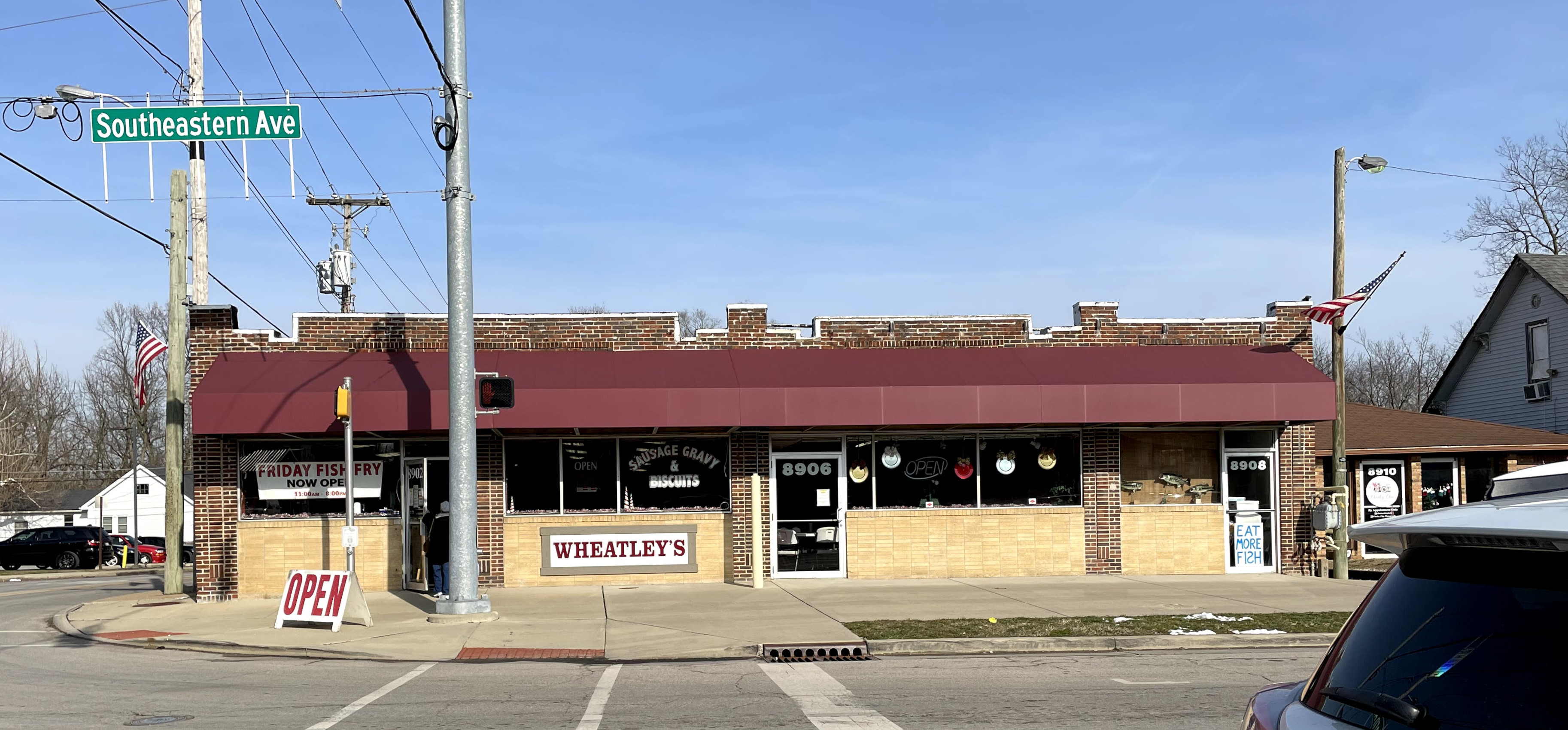 A single-story commercial building located on a block corner. 